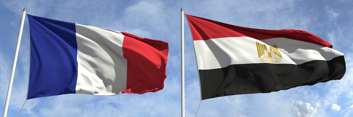 Waving flags of France and Egypt on flagpoles, 3d rendering