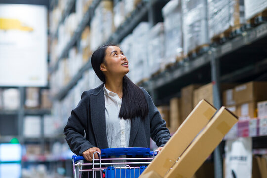 Young Woman Shopping in the warehouse-type supermarket