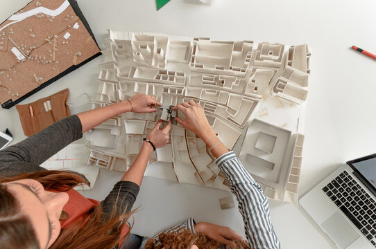 Students making architectural volumetric project