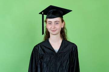 Happy french female graduate student with academic dress and cap