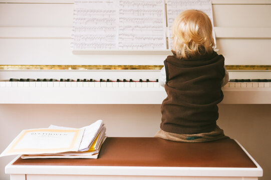 Toddler plays piano