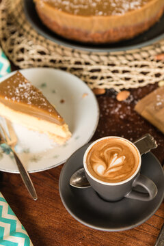 focus on piccolo latte coffee, with salted caramel cheesecake