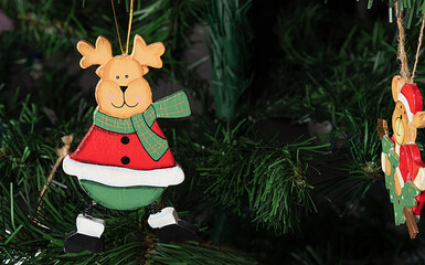 Christmas tree with Christmas wooden characters. Santa deer on green background
