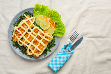 Crispy chicken with lemon cream, beautifully decorated.