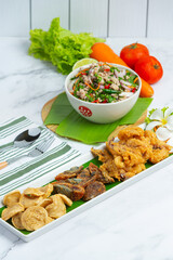 Mixed Spicy Salad with Vietnamese Sausage, Preserved Egg and Crispy Squid, Thai Food.