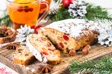 Fototapeta na wymiar Stollen traditional Christmas ftuitcake with dried fruit and nut