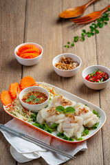 Boiled dolly fish with spicy seafood sauce.