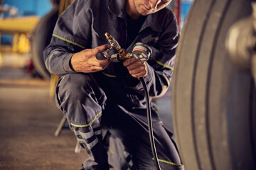 Engineer inspecting jet aircraft in the hangar