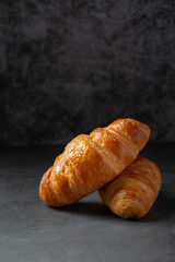 Croissants on black background.