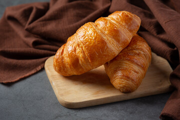 Croissants on black background.