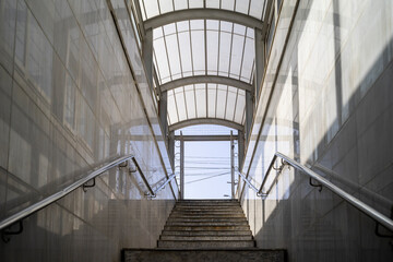 Access stairs to the tramway platform station from the underground pedestrian passage. - 379871637