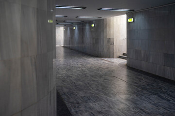 Underground passage for pedestrians with marble flooring and tiles. - 379871698