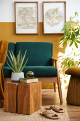 Interior design of modern living room with two mock up poster frames, elegant sofa, plant, pillow and personal accessories in stylish home staging. Honey yellow concept.