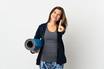 Obraz premium Slovak girl going to yoga classes isolated on white background showing and lifting a finger