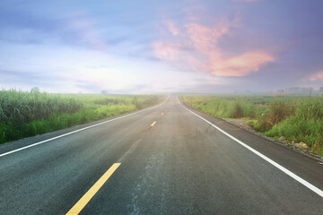 Beautiful view and scenery of asphalt road in the evening time of Thailand countryside.