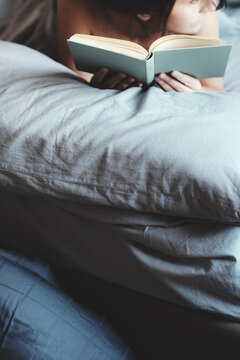 Woman reading in bed