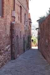 Typical alley in the ancient medieval village of Certaldo, Tuscany, Italy
