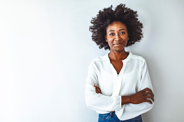 Portrait of a young African ethnicity businesswoman. Businesswoman with arms crossed looking at...
