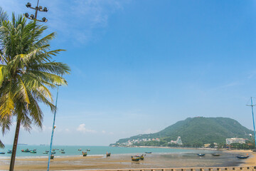 park in front beach of Vung Tau city with waves, coastline, streets, coconut trees and Tao Phung mountain in Vietnam