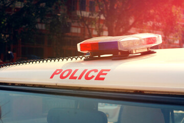 A police car with flashing lights in India.