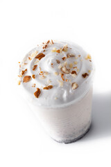 White chocolate, vanilla and nuts iced milkshake isolated on white background	