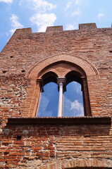 Window on an ancient palace in the ancient medieval village of Certaldo, Tuscany, Italy