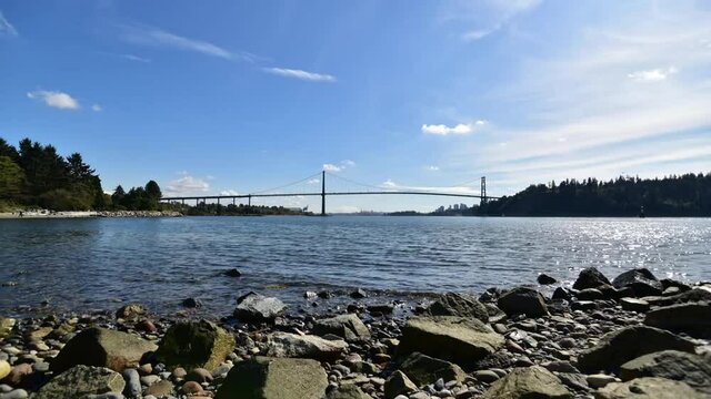 A timelapse movie of the Lion's Gate Bridge and the ocean at day time.   Wide Ver.  