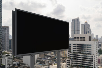 Obraz premium Blank black road billboard with Bangkok cityscape background at day time. Street advertising poster, mock up, 3D rendering. Side view. The concept of marketing communication to promote or sell idea.