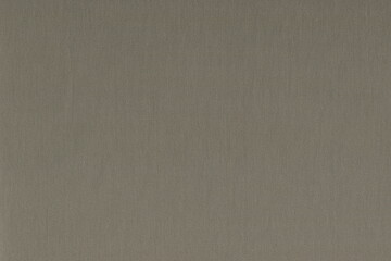 The texture of the pure wool fabric is dark gray. Coarse natural woolen fabric of gray or brownish color.