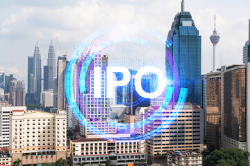 IPO icon hologram over panorama city view of Kuala Lumpur. KL is the hub of initial public offering...