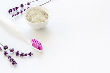 Herbal organic tooth powder with toothbrush close up