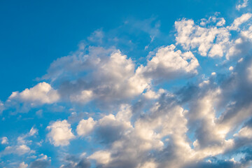 Blue sky background with a tiny clouds