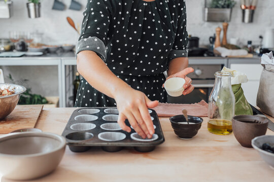 Woman Cook Preparing Mould for Baking Maffins
