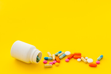 Pills bottle with medicines and vitamins, close up