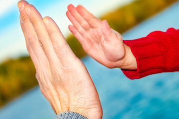 A beautiful hands of parent and child by the sea