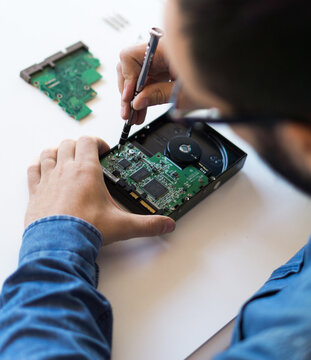 Man fixing hard disk