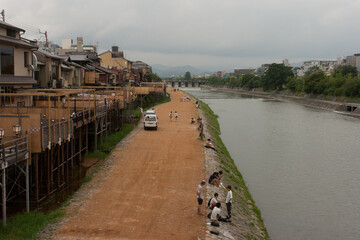 KYOTO, JAPAN - Aug 14, 2012: A shot of the Kamogawa River Bank in Kyoto, Japan