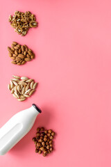 Vegan alternative nuts milk in bottles. Above view