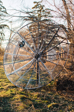 Large old satellite in a yard.