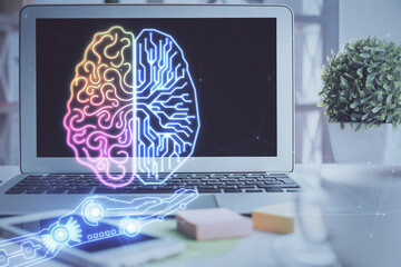 Double exposure of work space with computer and human brain drawing hologram. Brainstorm concept.