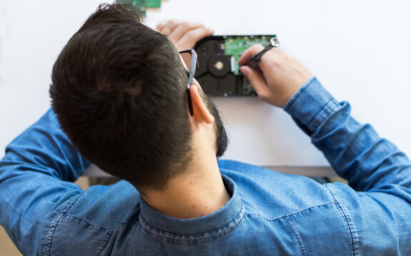 Man fixing hard disk