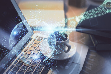 Double exposure of desktop computer and technology theme hologram. Concept of software development.