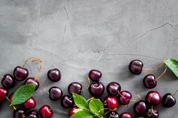 Sweet red cherries with leaves, flat lay, top view