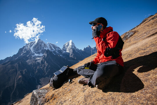 Man talking on his cellphone in mountain