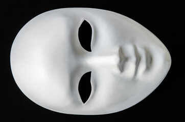 white mask on black backgorund