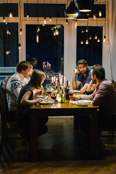 Friends having dinner at home