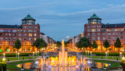 Fototapeta premium Mannheim, Germany. June 16th 2013. View on Friedrichsplatz with water and light games.