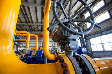 Aktobe region/Kazakhstan - May 04 2012: Oil refinery plant. Gas power station. High-pressure yellow gas pipeline and. valve armature.