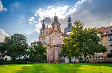 Fototapeta na wymiar The Jesuit Church with the Schillerplatz lawn in the foreground.