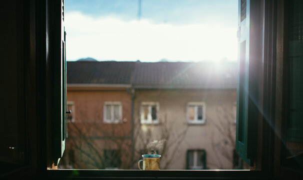 Fototapeta cup of coffee in the window